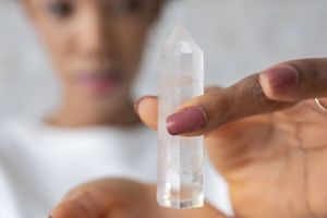 A person's hands in a meditative gesture, showing focus.